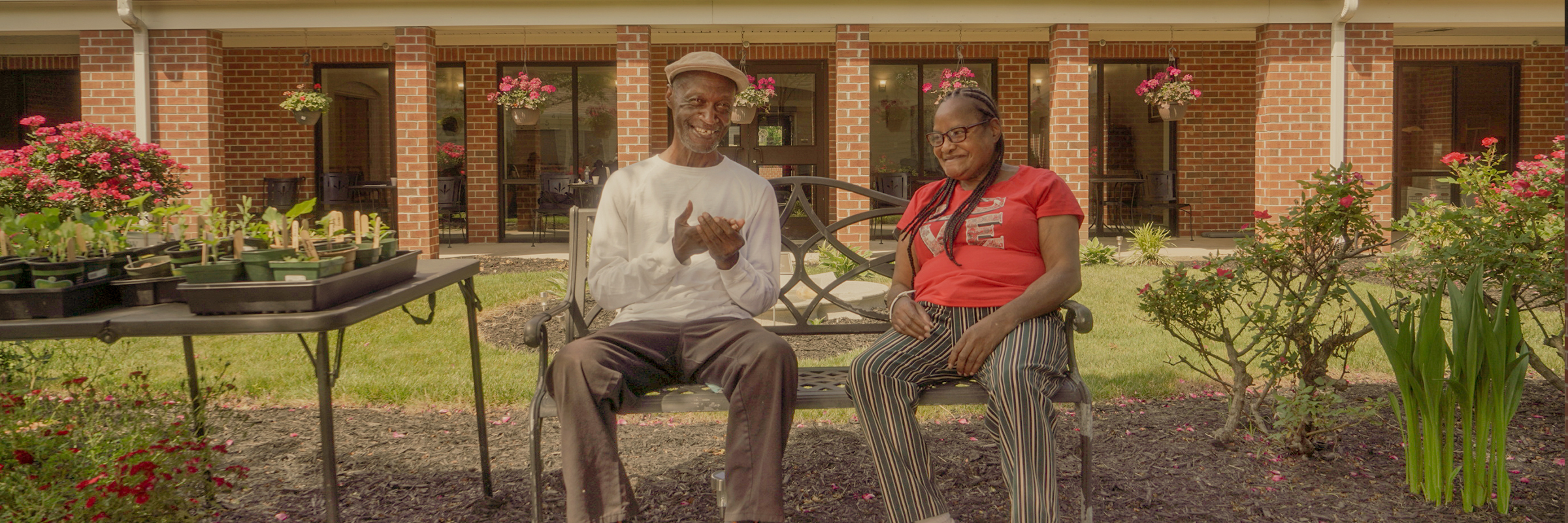 Two people sitting on a bench