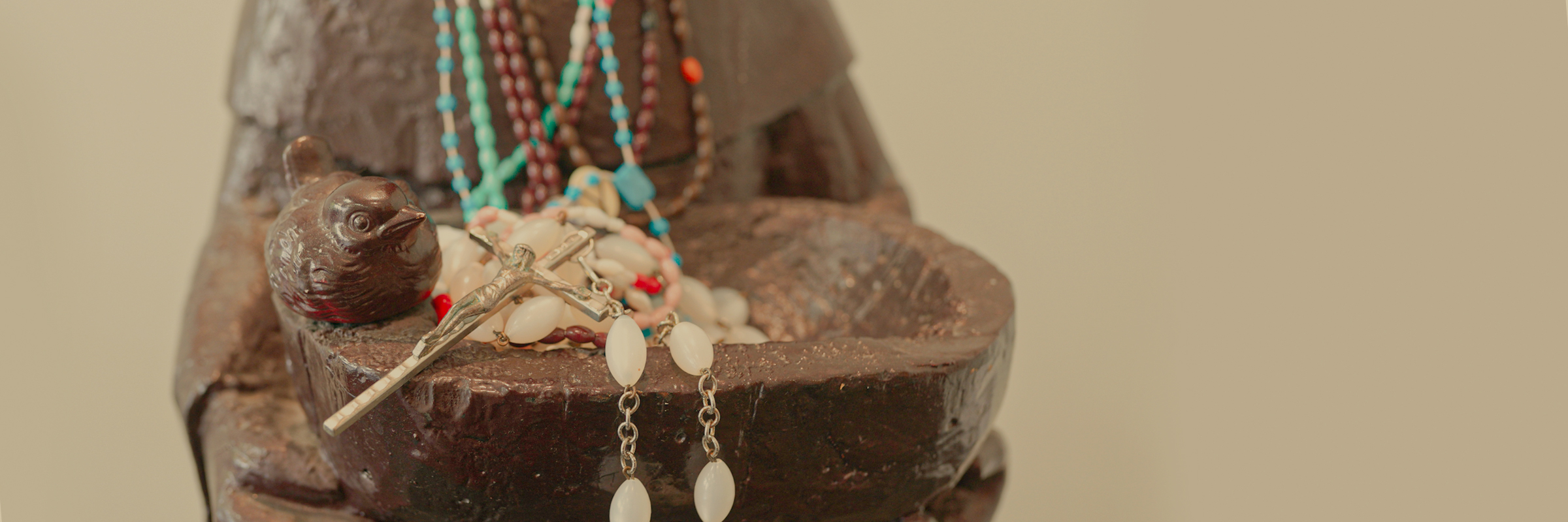 Bowl with bird and rosaries