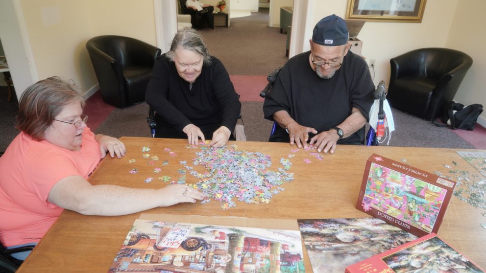 Residents putting together a puzzle